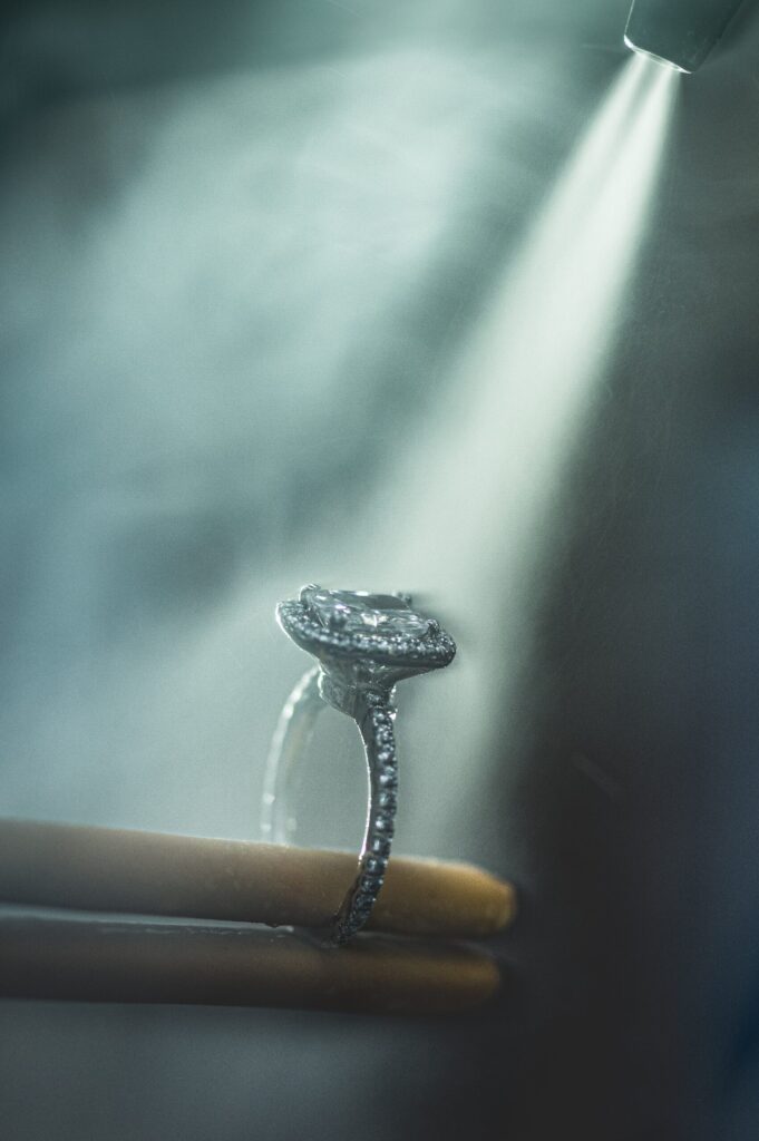 Ring in an upright position with a smokey spraying on the ring.