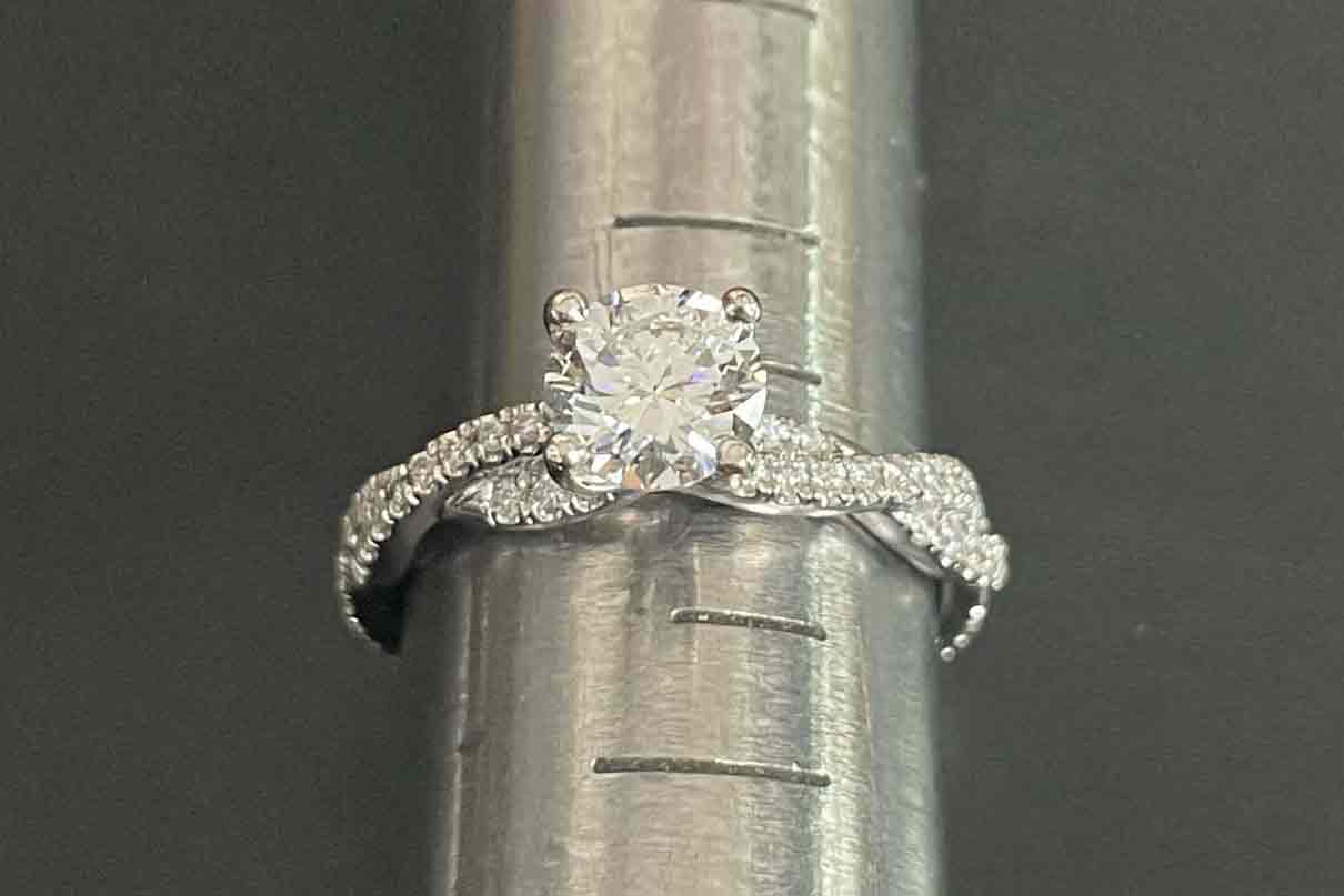 Piece of diamond ring in a ring resizing.