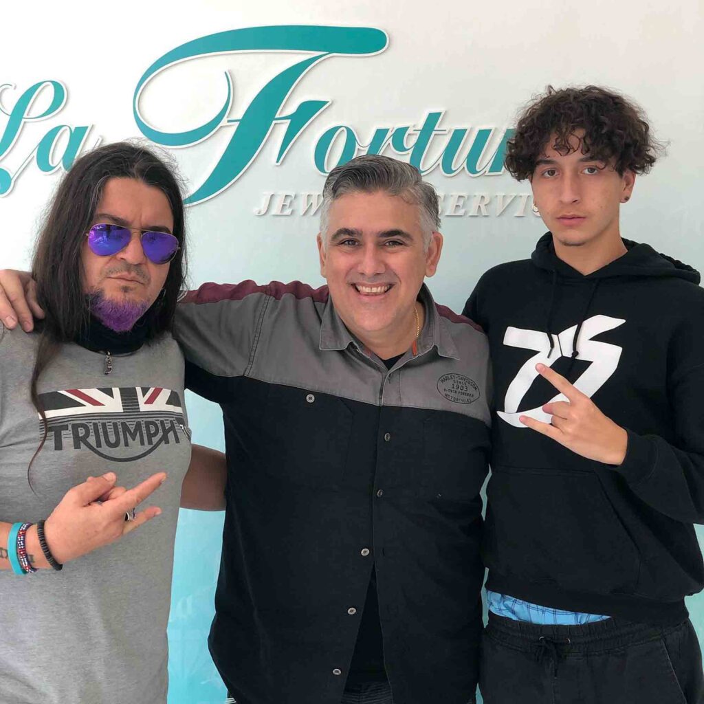 Men posing with Misael.